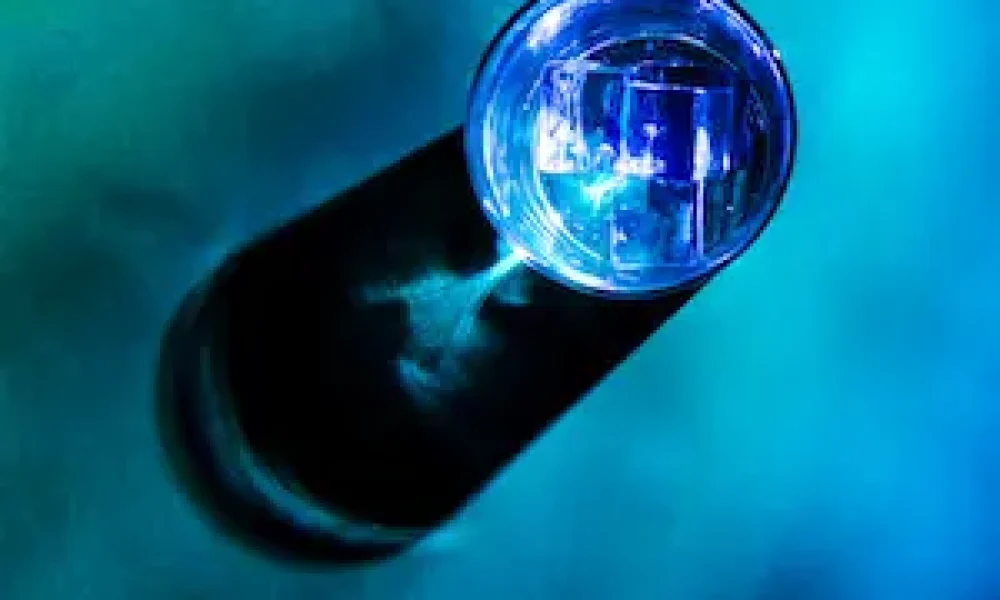 ice-cubes-blue-glass-with-shadow-colored-background-scaled