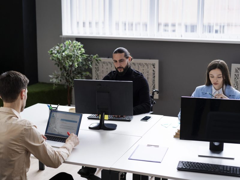 medium-shot-people-working-with-computers